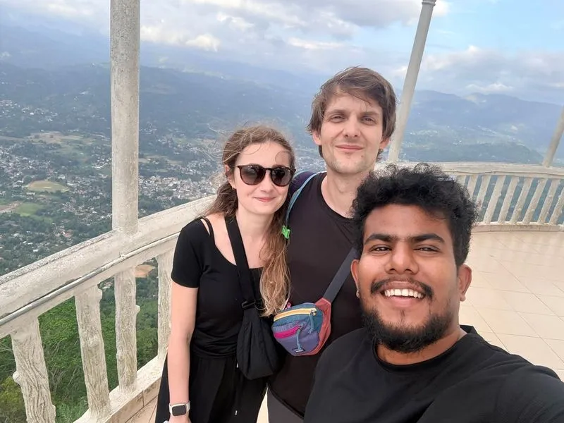 The four founders of Aitken Travels on a scenic Sri Lanka road